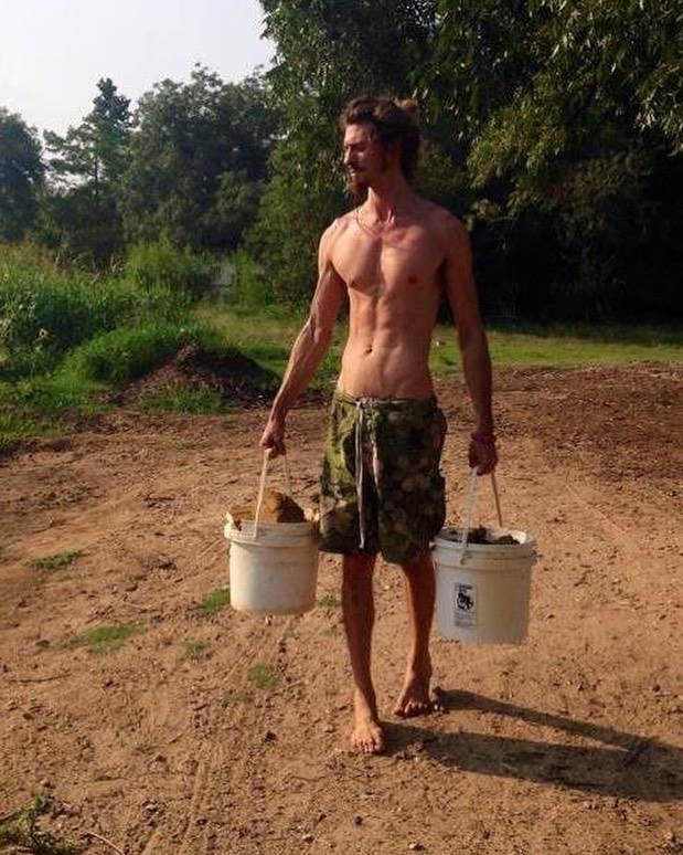 Quinn carries compost buckets