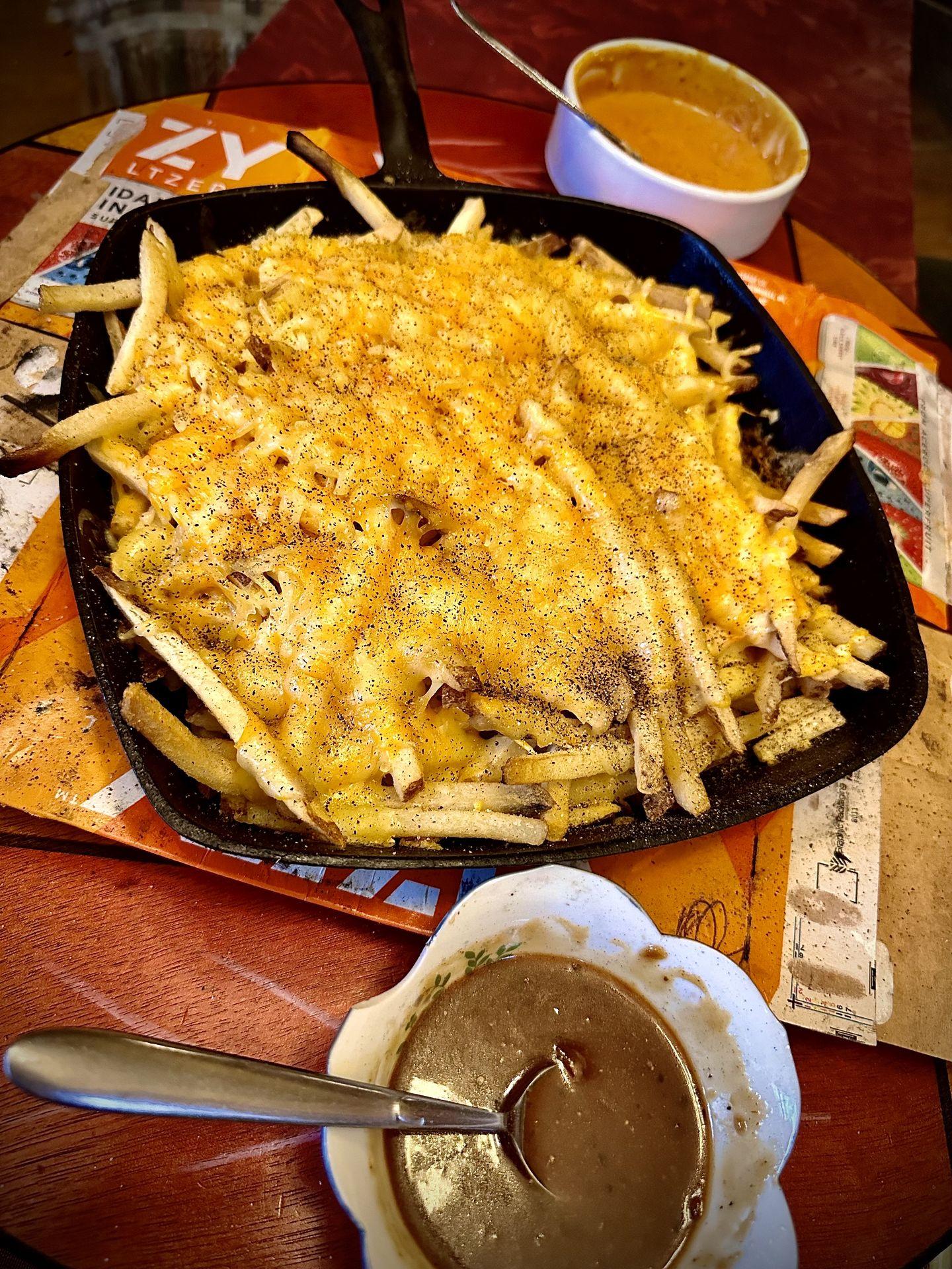 Cheesy fries from The Garden of Eden with sauces