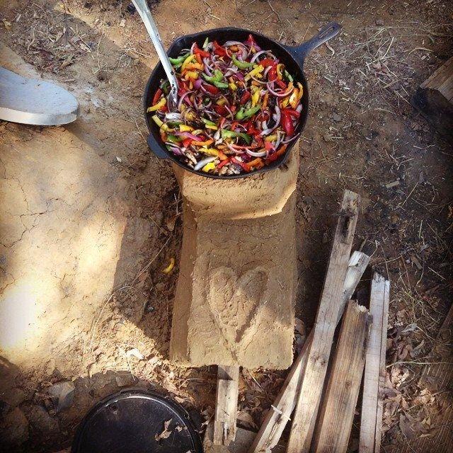 Cooking with love on the earthen cob rocket stove