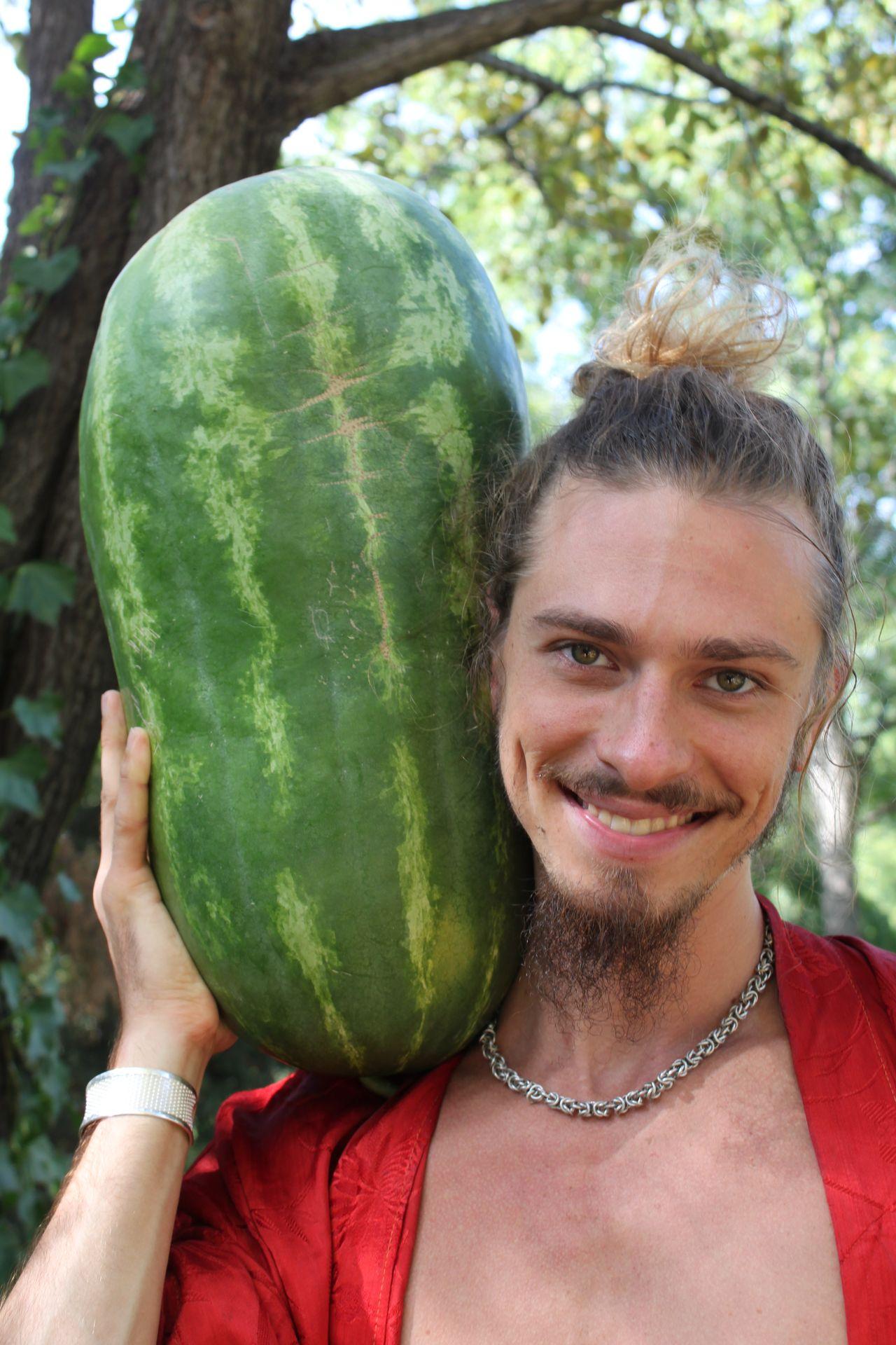 Quinn shoulders a watermelon much bigger than his head