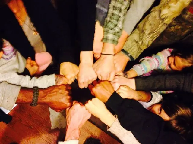 The Garden of Eden community fist bumps.