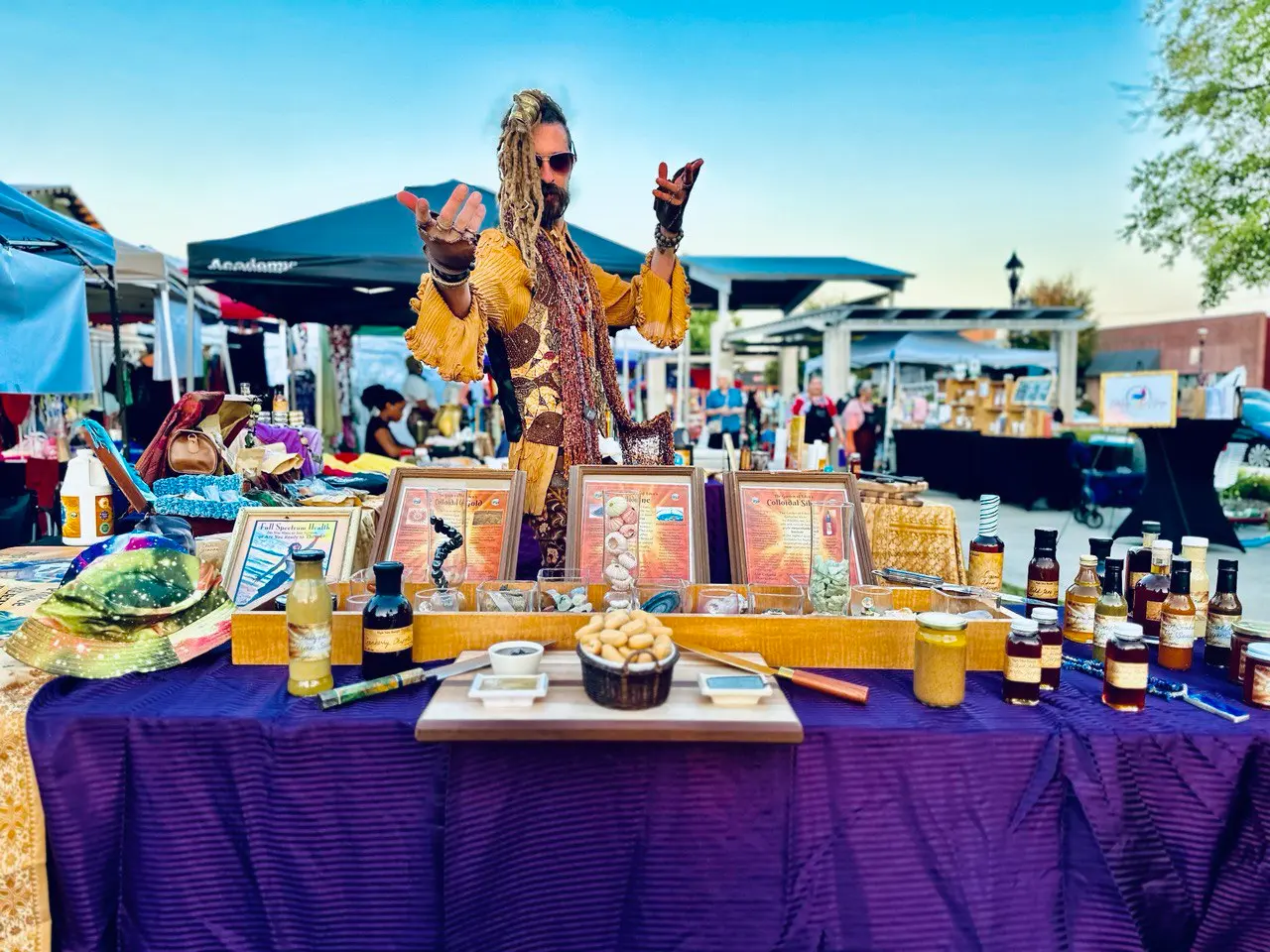 Quinn invites you to the table at an outdoor market